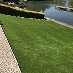 25mm Artificial grass lawn on slope leading to the water's edge