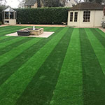 Striped artificial grass lawn