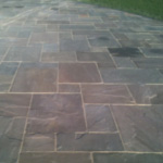 Bradstone autumn green Indian stone paving with buff pointing