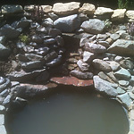 Small granite waterfall into circular sump