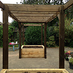 Walk through pergola with new oak raised beds